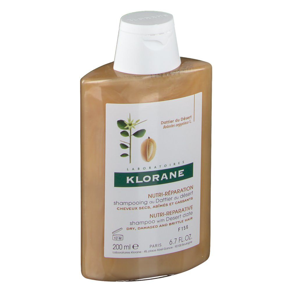Flacon de shampooing avec bouchon blanc. Étiquette avec informations produit et logo. Texte: KLORANE, Nutri-Réparation, Datte du Désert.