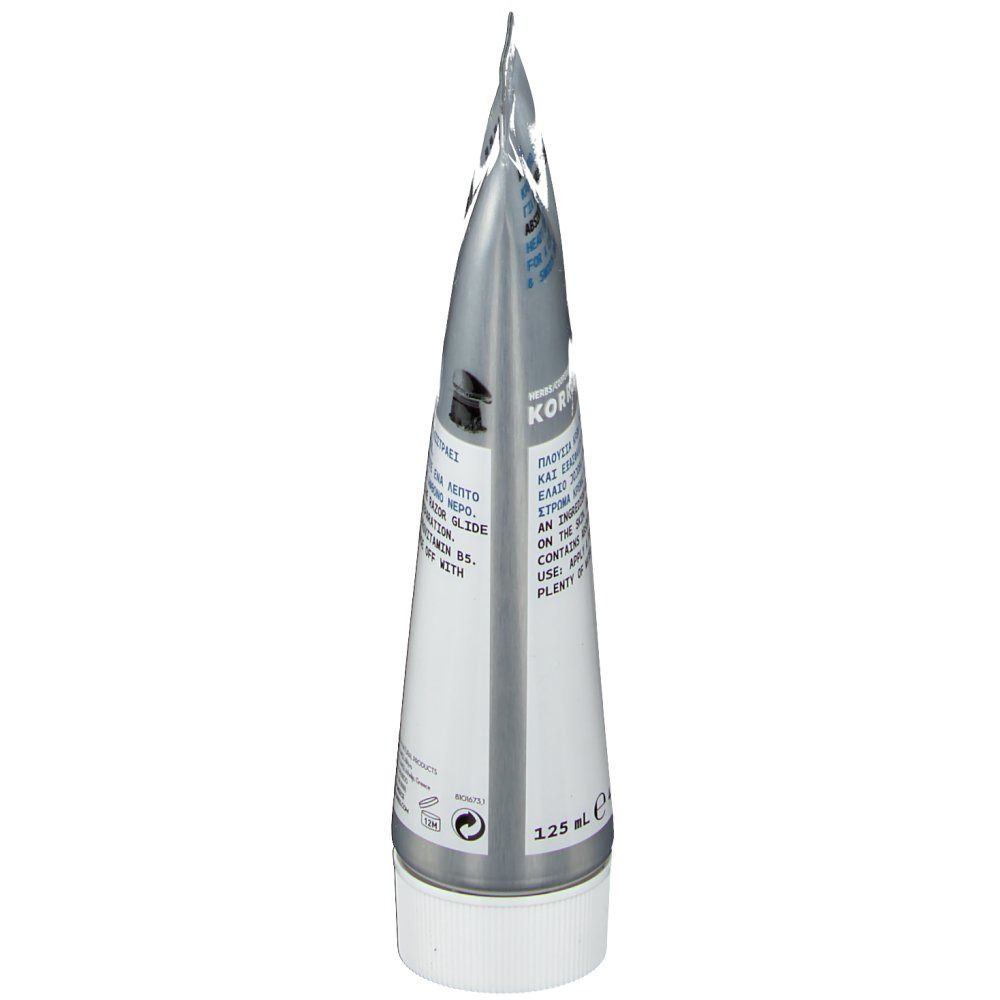 Zicht op de punt van een zilveren tube met witte schroefdop. Tekst in meerdere talen. Volume: 125 ml.