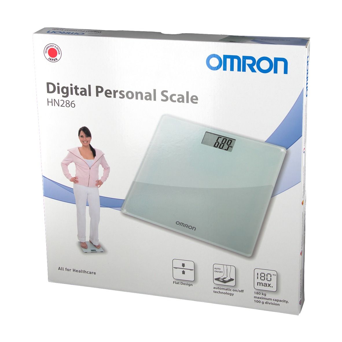Verpakking van de OMRON HN286 digitale personenweegschaal. Display 68,9. Vrouw op weegschaal. Plat ontwerp, 180 kg max.