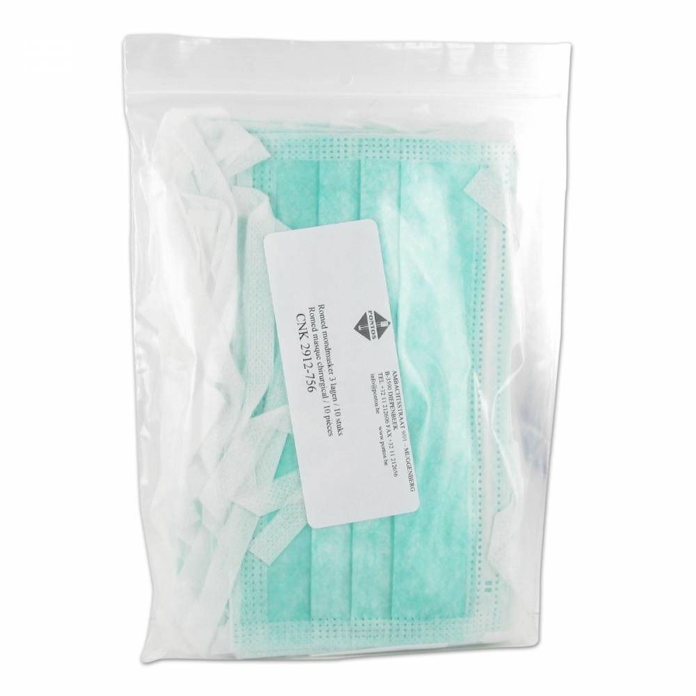 Emballage de masques buccaux verts. Les masques sont emballés dans un sac en plastique transparent. Une étiquette est visible.