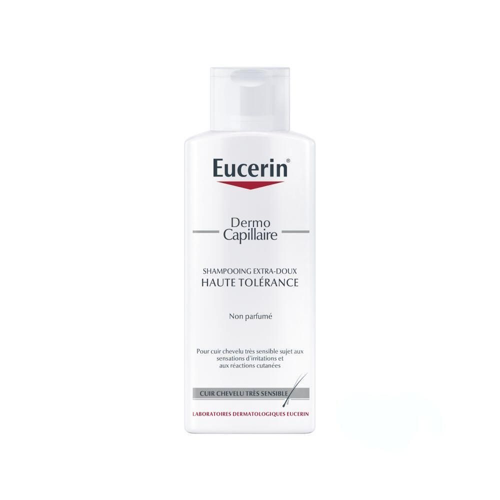 Flacon blanc Eucerin DermoCapillaire Shampoo. Bouchon blanc. Inscription: Shampooing Extra-Doux Haute Tolérance. Non parfumé.