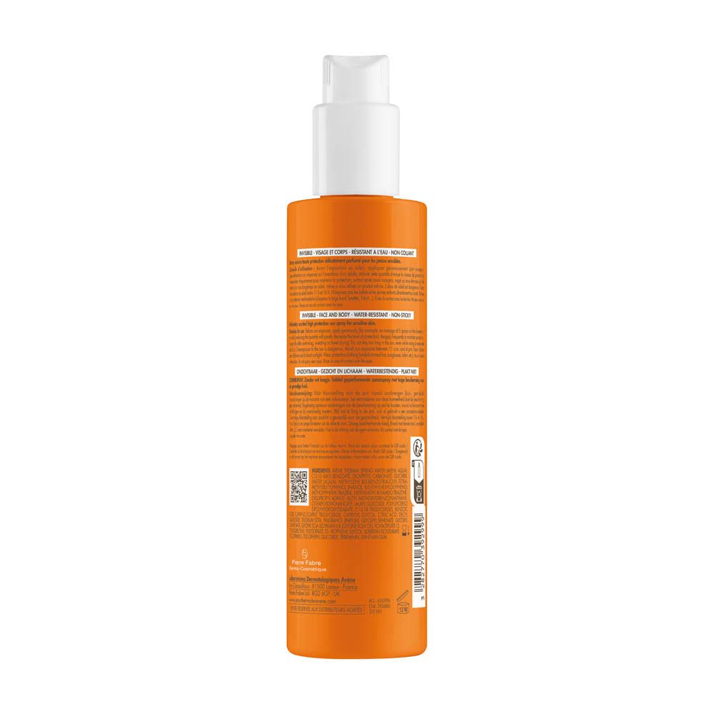 Dos d'un flacon orange avec bouchon blanc. Texte et logos.