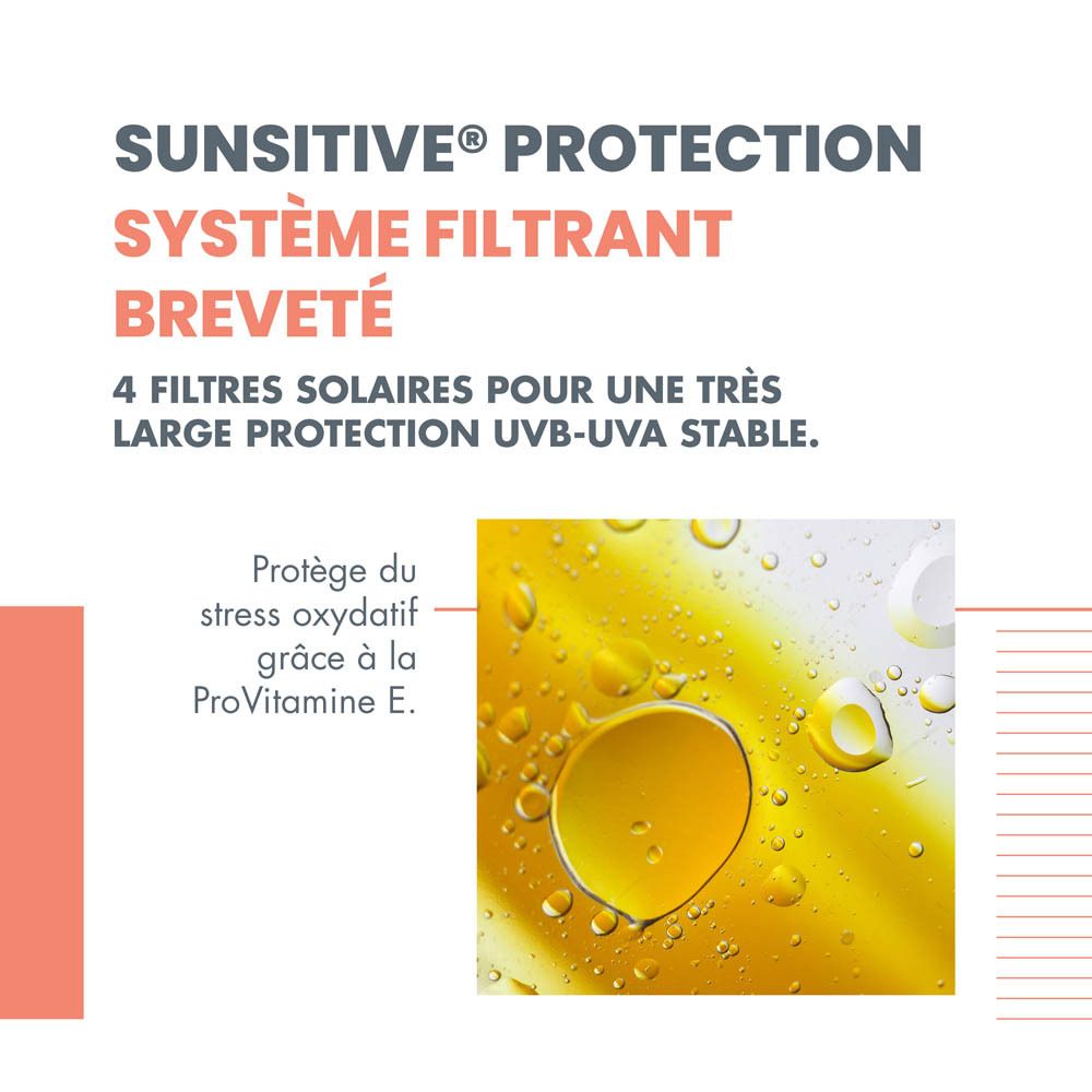 Flacon orange avec bouchon blanc. Inscription: Eau Thermale Avène, SPF 30, Spray.