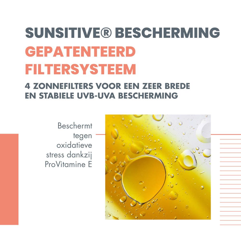Oranje fles met witte sproeikop. Opschrift: Eau Thermale Avène, SPF 30, Spray.