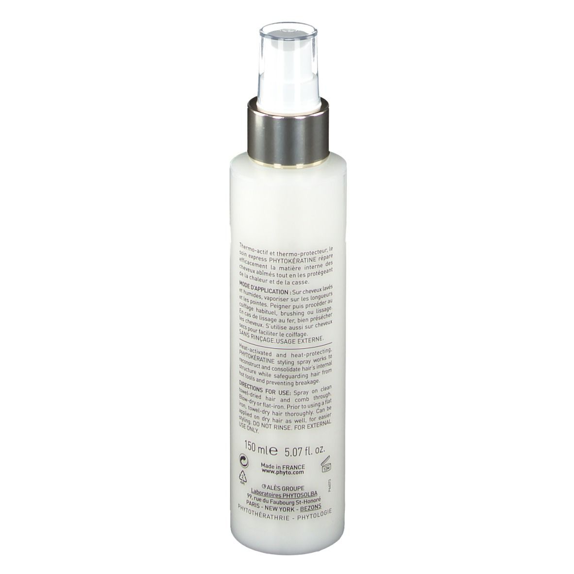 Spray blanc avec bouchon argenté. Texte sur le côté, dont ingrédients et mode d'emploi.