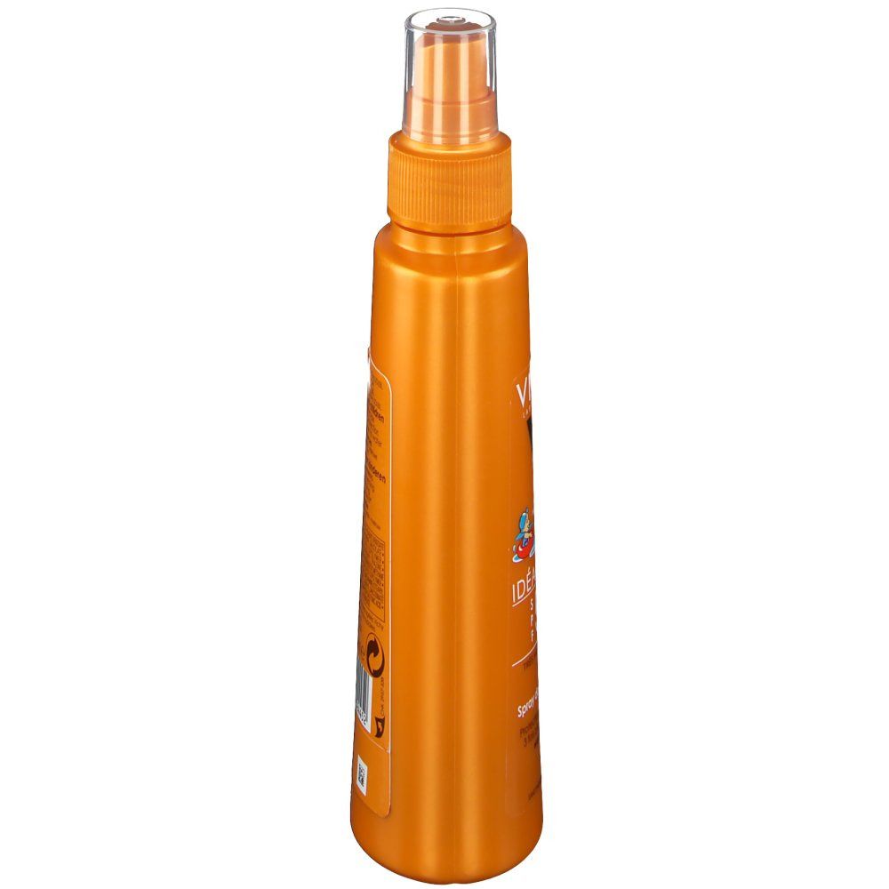 Flacone spray arancione, vista laterale. La testa dello spruzzo è trasparente. Sul flacone sono stampate informazioni sul prodotto.
