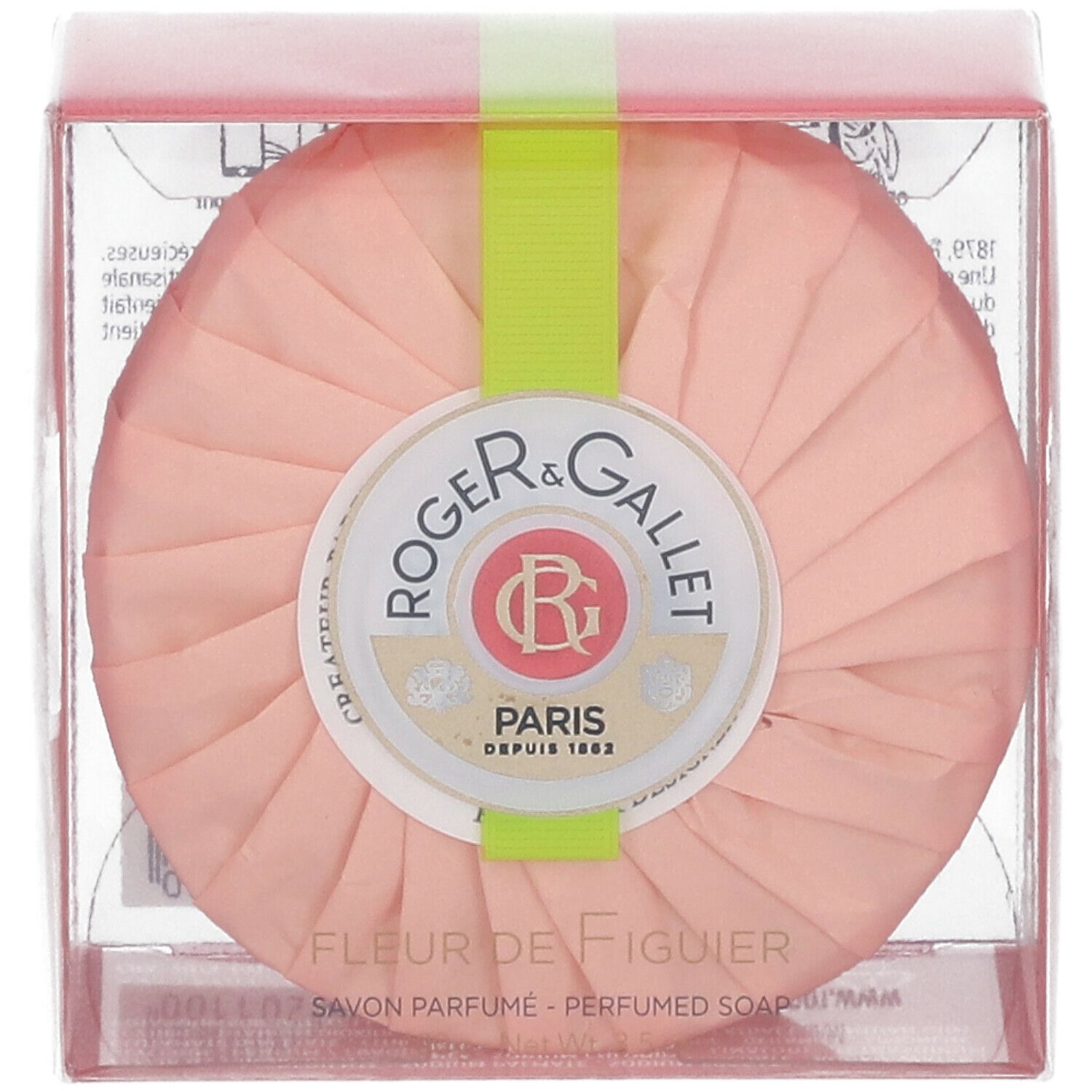 Savon rond rose dans emballage transparent. Ruban vert. Logo et texte: Fleur de Figuier, Savon Parfume.