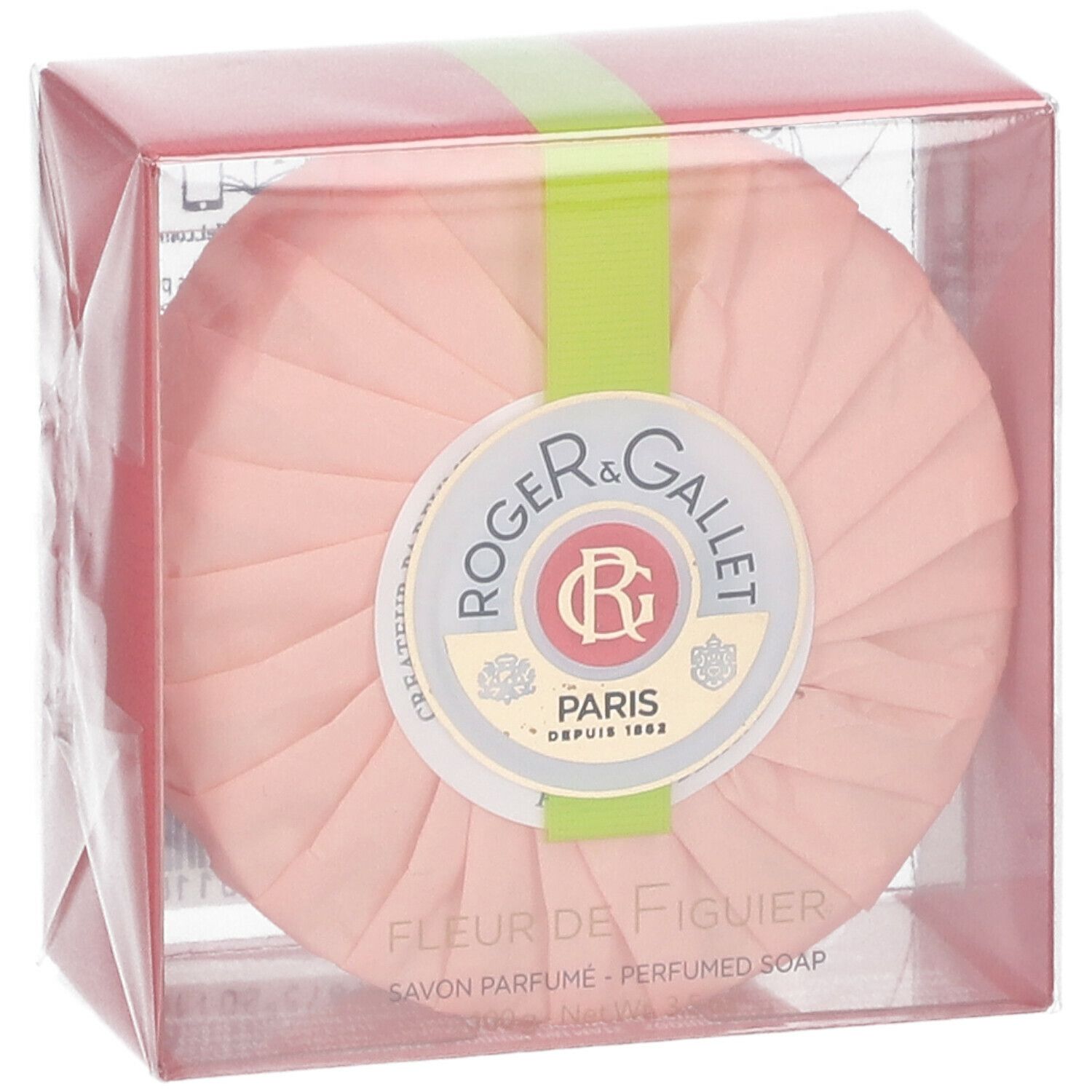 Savon rond rose dans emballage transparent. Ruban vert. Logo et texte: Fleur de Figuier, Savon Parfume.