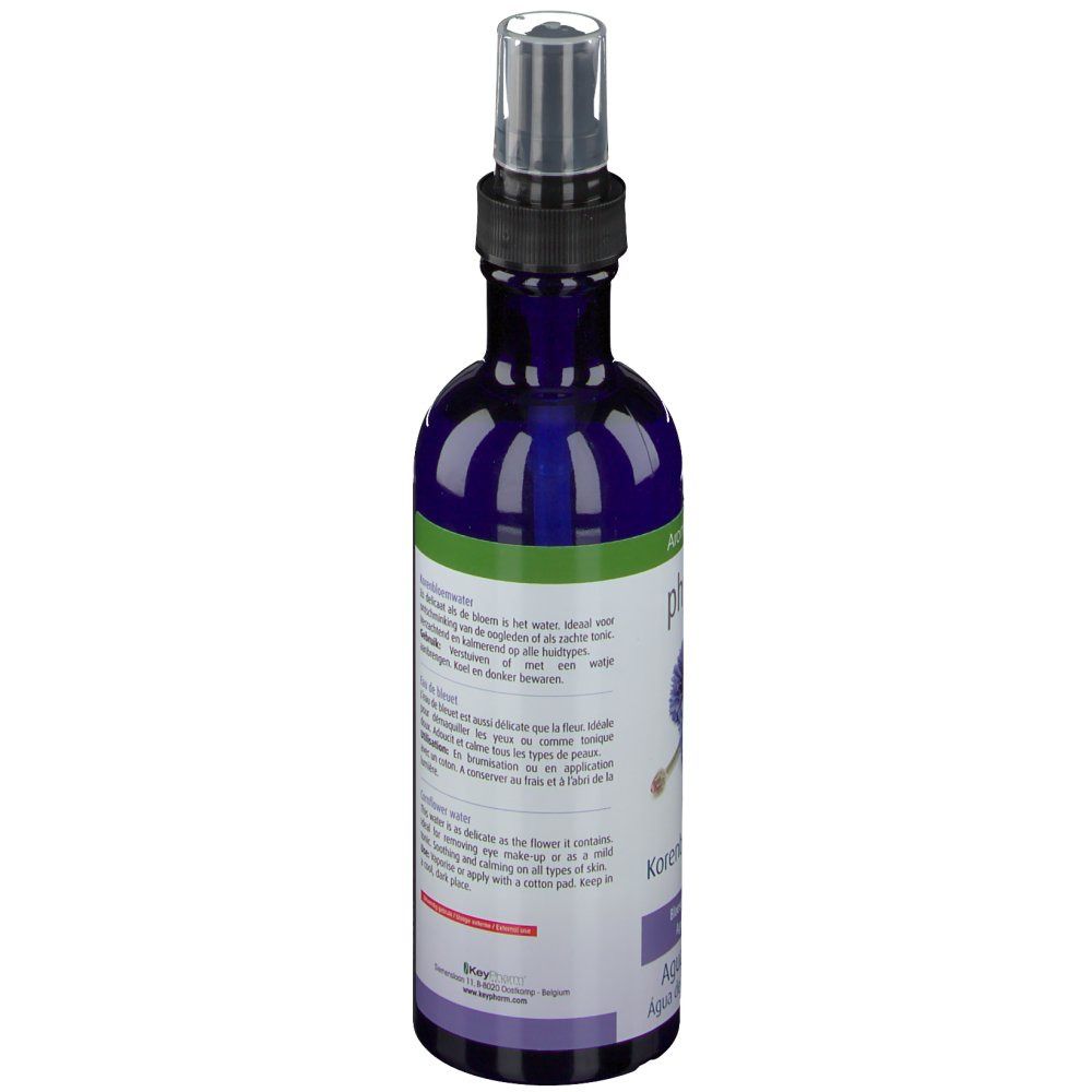 Dos d'une bouteille bleue avec vaporisateur. Texte multilingue. Certification bio.