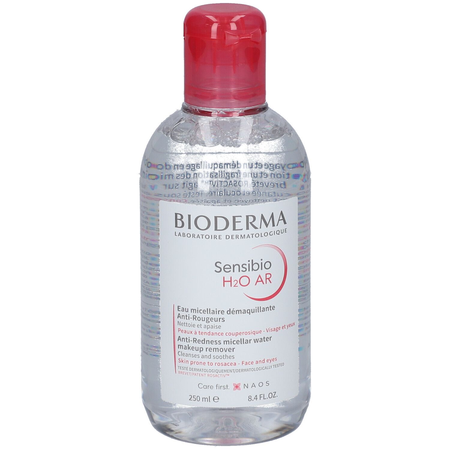 Klare Flasche mit rotem Deckel. BIODERMA Sensibio H2O AR, Mizellen-Reinigung. Text in mehreren Sprachen.