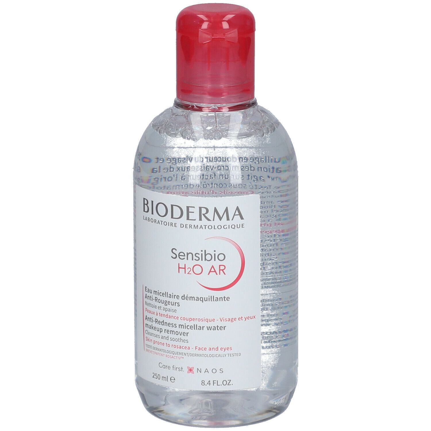 Klare Flasche mit rotem Deckel. BIODERMA Sensibio H2O AR, Mizellen-Reinigung. Text in mehreren Sprachen.