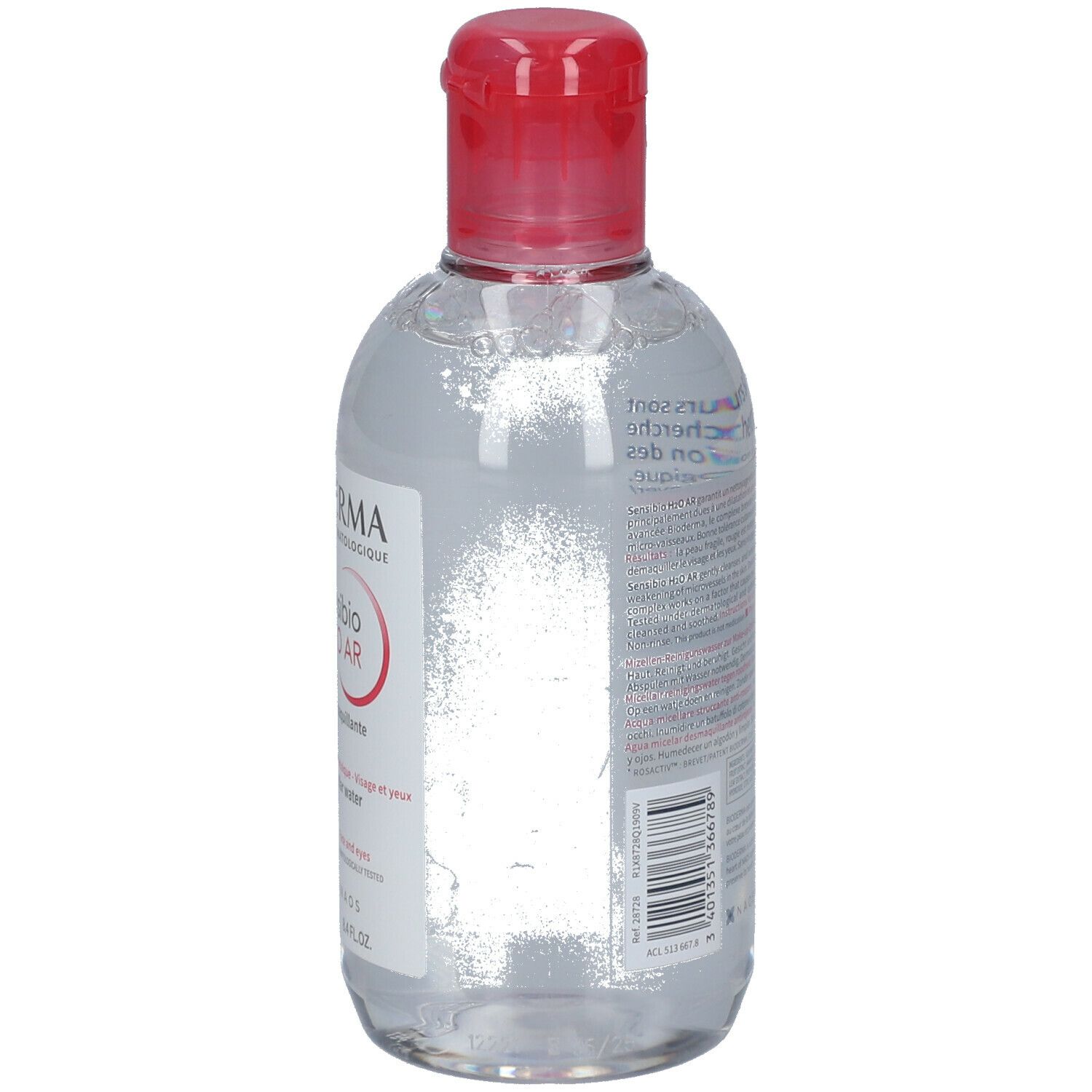 Rückseite einer transparenten Flasche mit rotem Deckel. Text auf dem Etikett, Barcode.