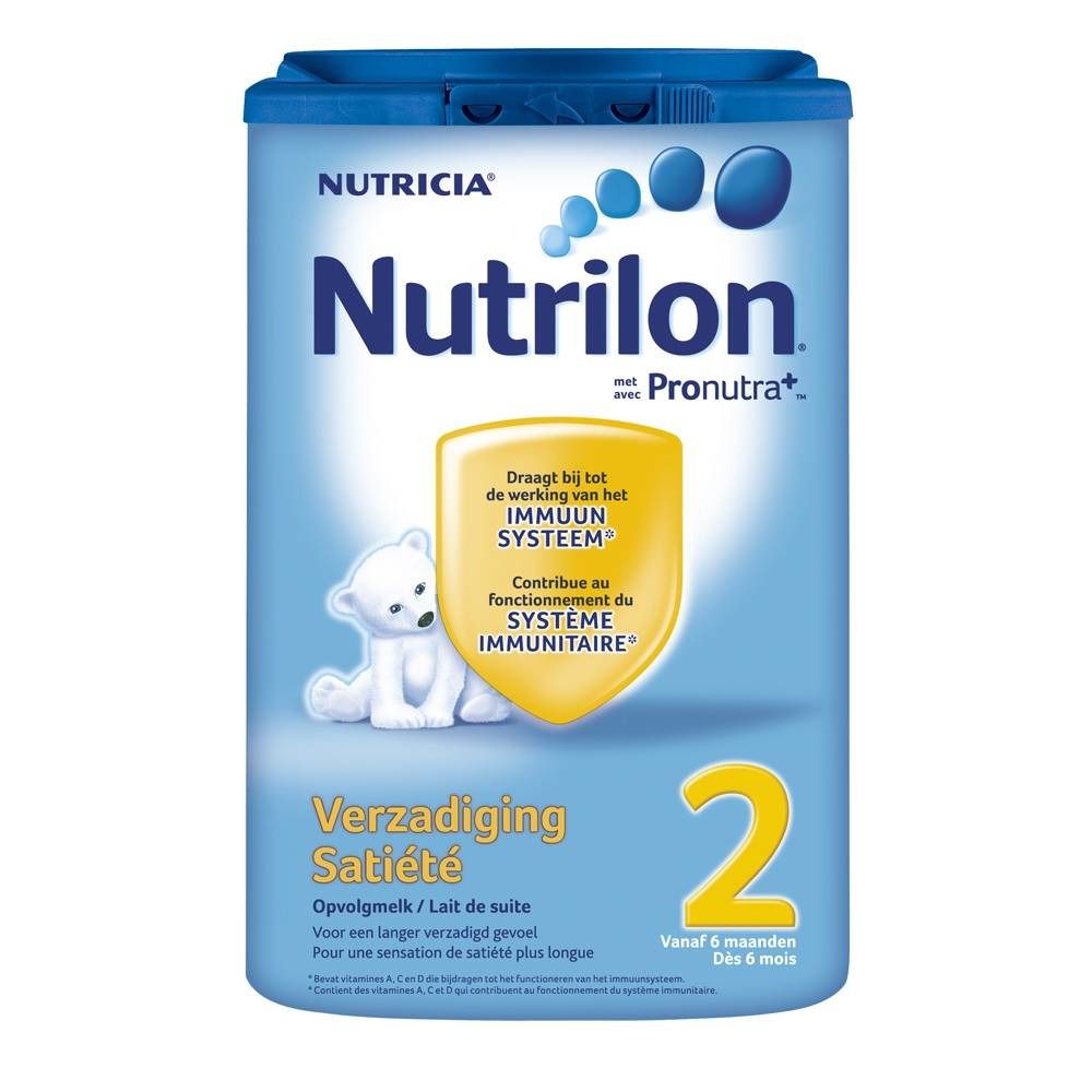 Boîte bleue Nutrilon Satiété 2. Inscription Nutrilon, ours, écusson jaune avec texte. Couvercle bleu.