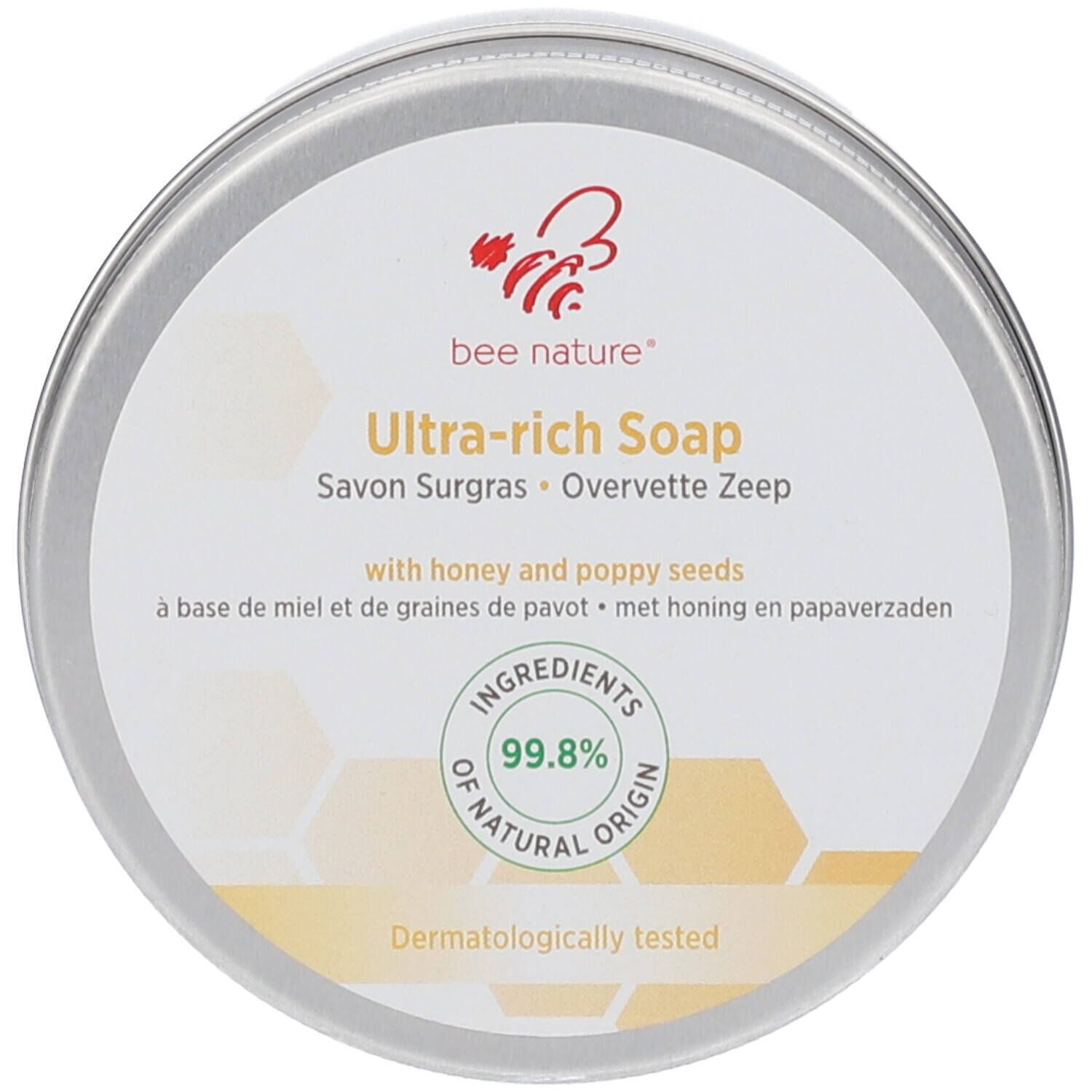 Boîte ronde avec couvercle. Inscription: bee nature® Ultra-rich Soap. 99,8% d'ingrédients d'origine naturelle.