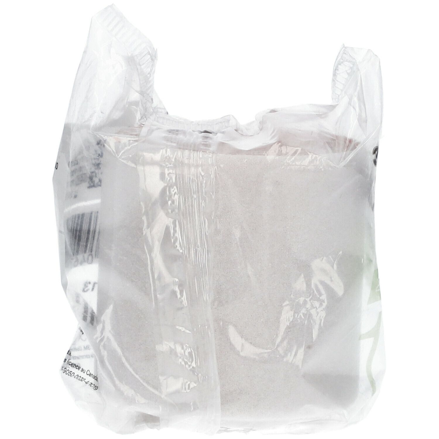 Rückansicht der Verpackung. Weißes Verbandmaterial in transparenter Folie. Etikett mit Barcode und Text.