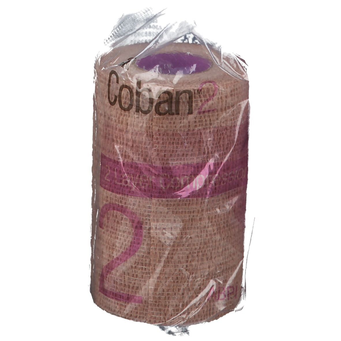 Bande de compression emballée. Inscription: Coban 2. Beige et rose. Gros plan.
