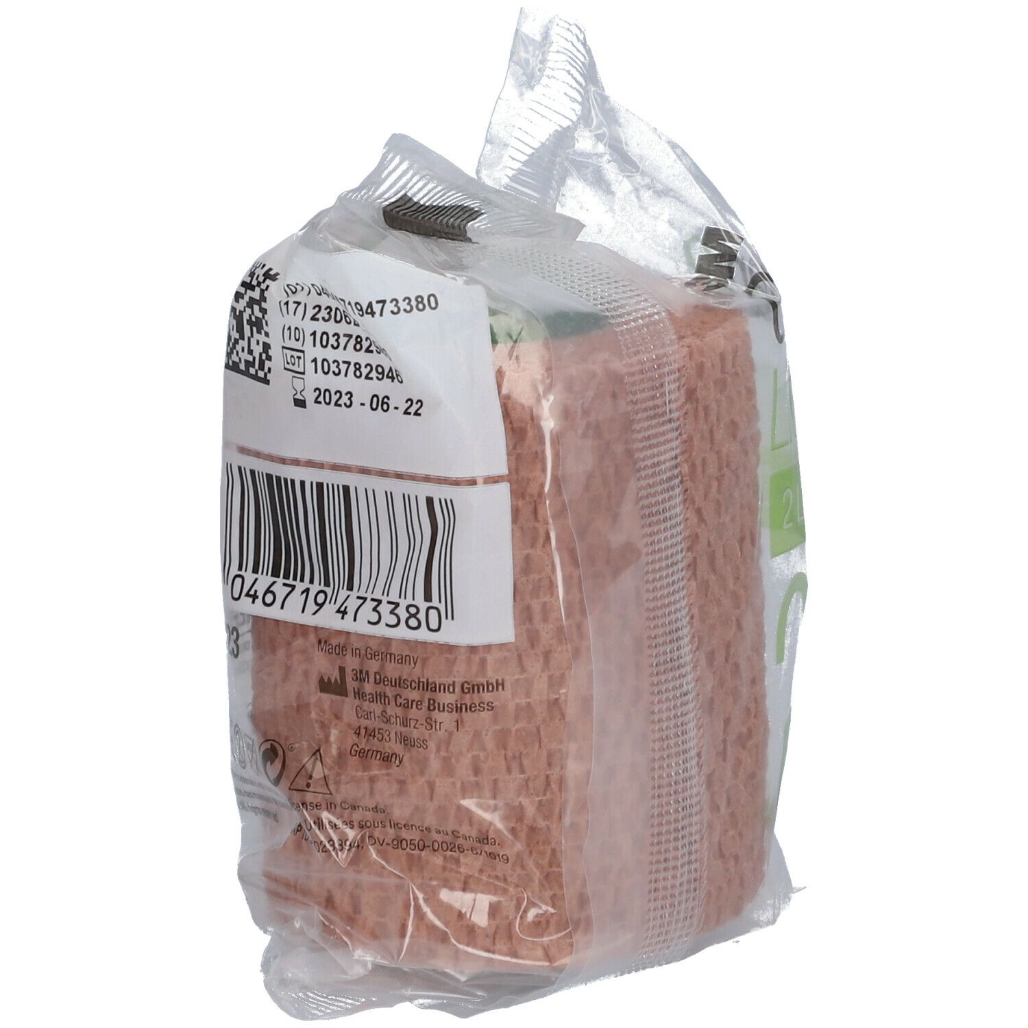 Dos d'une bande de compression dans un emballage plastique. Code-barres et numéro de lot visibles. Couleur beige.