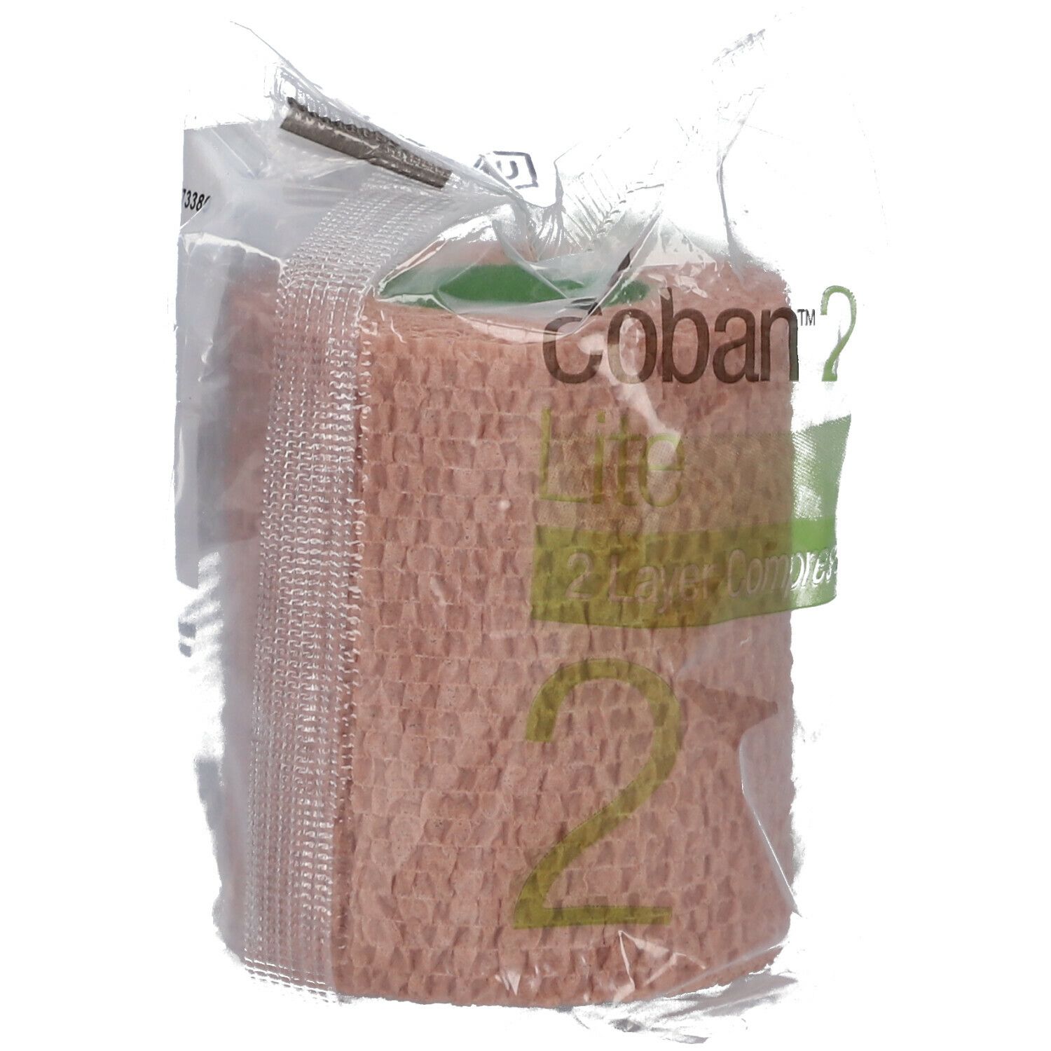 Bande de compression dans un emballage plastique. Inscription "Coban 2". Couleur beige. Écriture verdâtre.