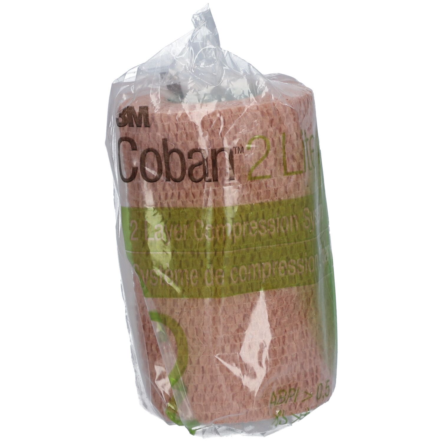 Bande de compression dans un emballage transparent. Inscription : 3M Coban 2 Lite. Couleur beige-rose.