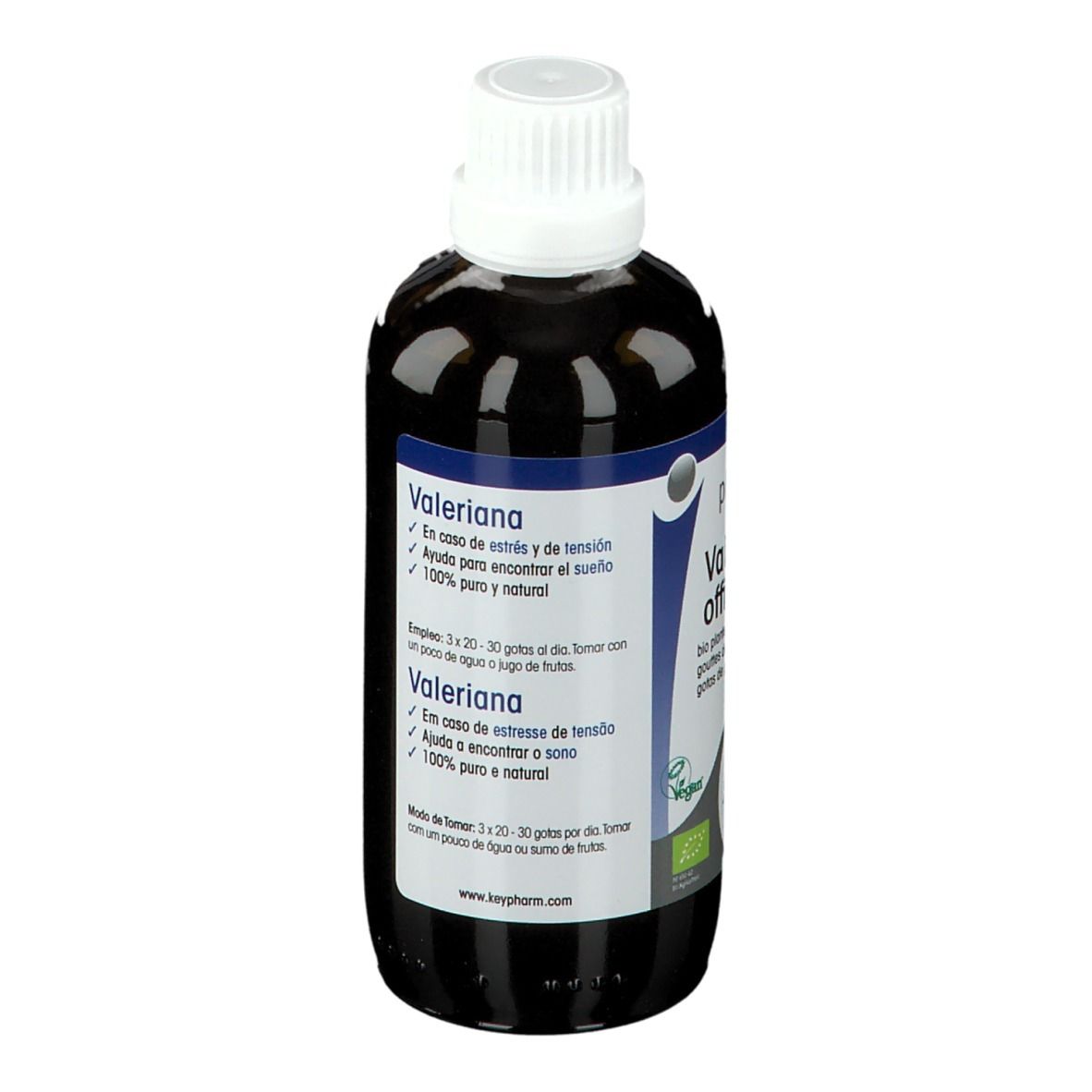 Flacon de liquide brun avec bouchon blanc. Étiquette avec informations produit. Label bio.