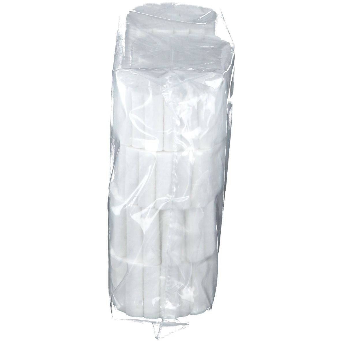 Rouleaux de coton dentaire dans un emballage plastique. Plusieurs piles de rouleaux blancs, emballage transparent.