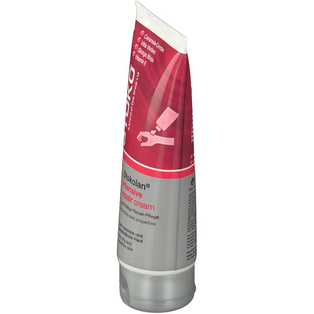 Tube de crème STOKOLAN® Intensiv-Reparierende Creme. Design rouge et blanc. Inscription: Intensiv repair cream. Contient Céramides, Vitis Vinifera, Ginkgo Biloba, Vitamine E.