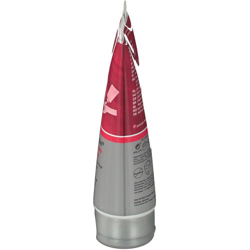 Vue latérale d'un tube. Partie supérieure rouge, corps gris. Inscription en plusieurs langues.
