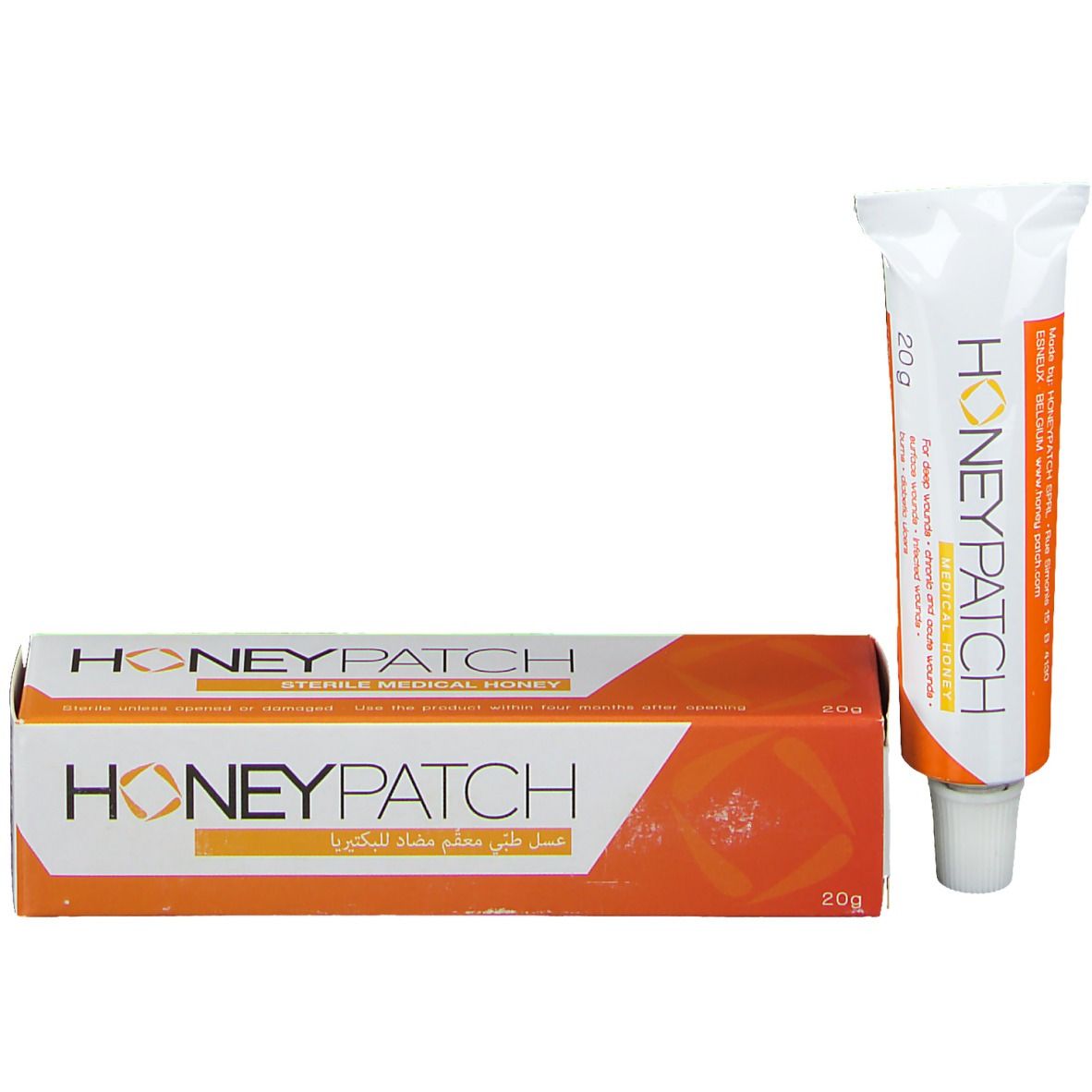 Verpakking met tube honing. Wit-oranje ontwerp. Opschrift: Honeypatch. 20g. Steriele medische honing. Arabisch schrift.