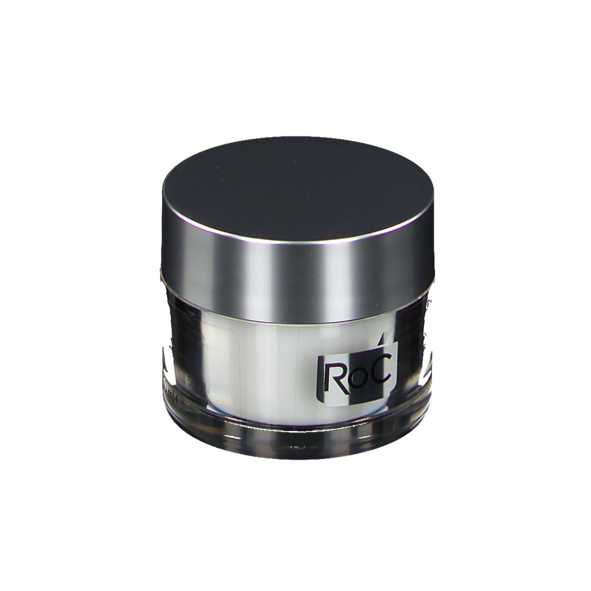 Pot de crème avec couvercle argenté. Logo RoC sur l'étiquette. Récipient transparent avec contenu blanc.