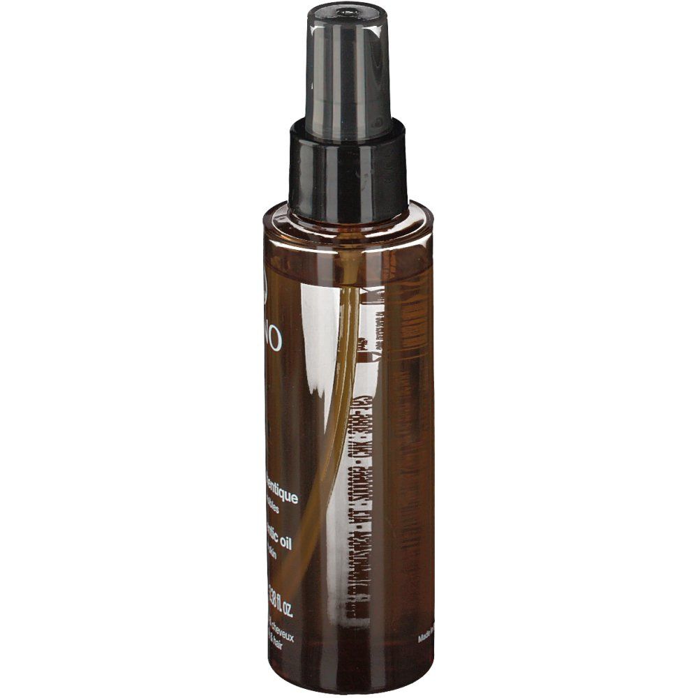 Flacon pulvérisateur brun avec bouchon noir. Étiquette avec informations produit. Liquide transparent visible.