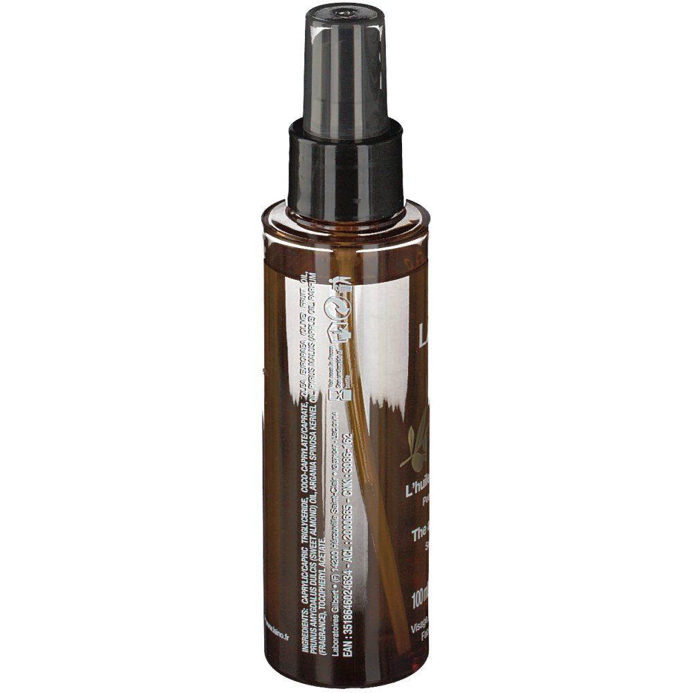 Flacon pulvérisateur brun avec bouchon noir. Étiquette avec ingrédients et informations produit. Inscription: LAINO.