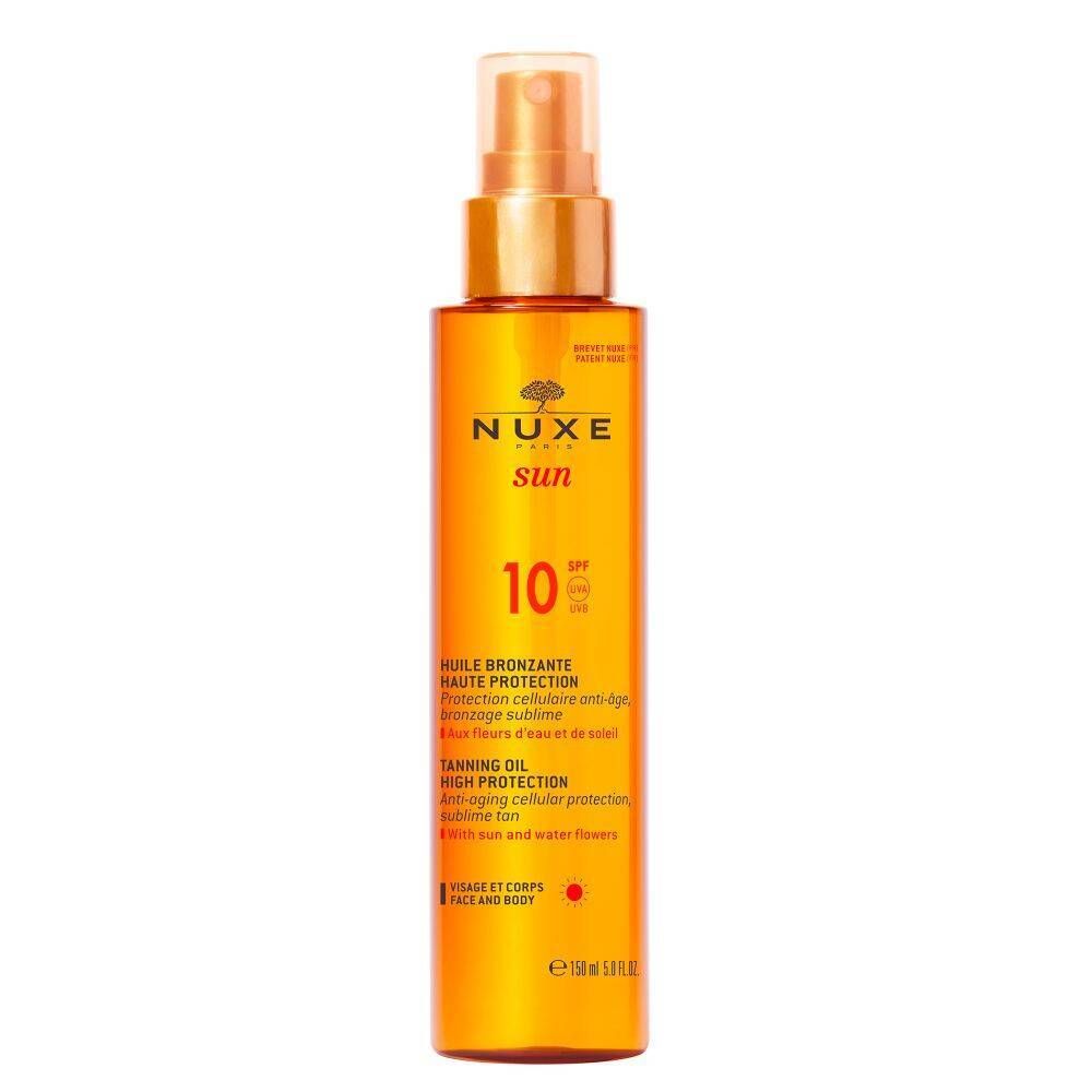 NUXE Sun Huile Bronzante Visage et Corps SPF 10. Flacon orange avec vaporisateur. Texte: Huile bronzante, SPF 10.
