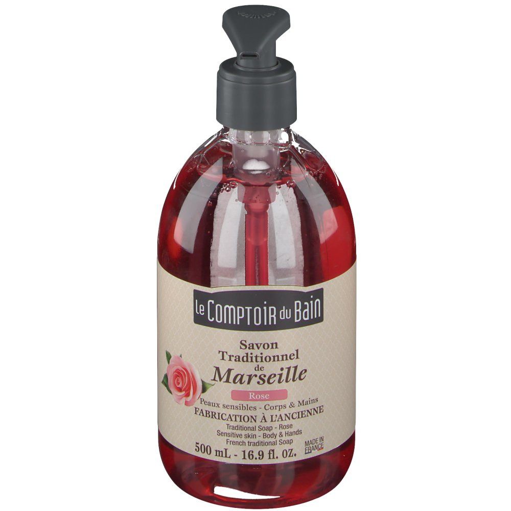 Savon liquide rouge avec pompe. Inscription: Le Comptoir du Bain, Savon Traditionnel de Marseille, Rose. 500 ml.