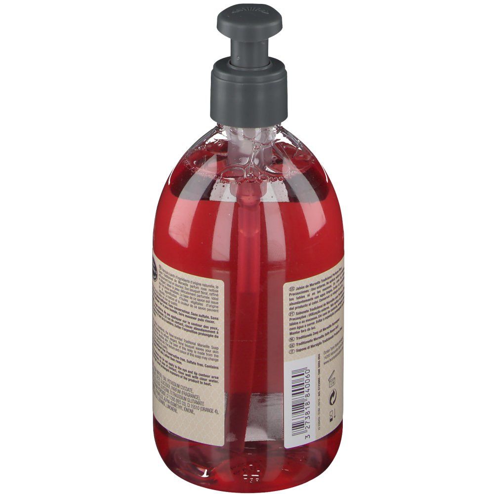 Savon liquide rouge avec pompe. Dos avec texte et étiquette. Inscription: Le Comptoir du Bain, Savon Traditionnel de Marseille.