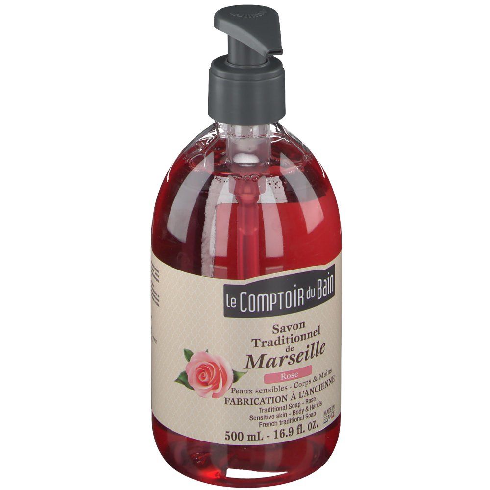 Savon liquide rouge avec pompe. Inscription: Le Comptoir du Bain, Savon Traditionnel de Marseille, Rose. 500 ml.