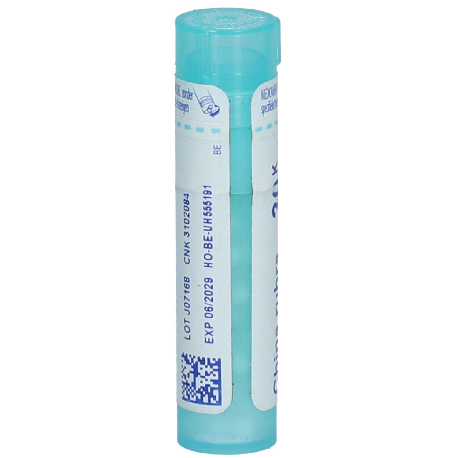 Tube cylindrique bleu. Étiquette avec texte et QR code. 'CNK 3102084' et 'EXP 06/2029' lisibles.