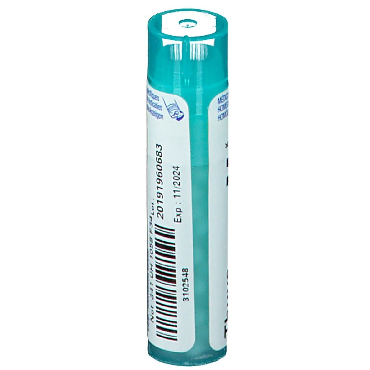 Cilindrische verpakking met blauwe dop. Opschrift: Thuya occidentalis, Boiron, lotnummer en vervaldatum.
