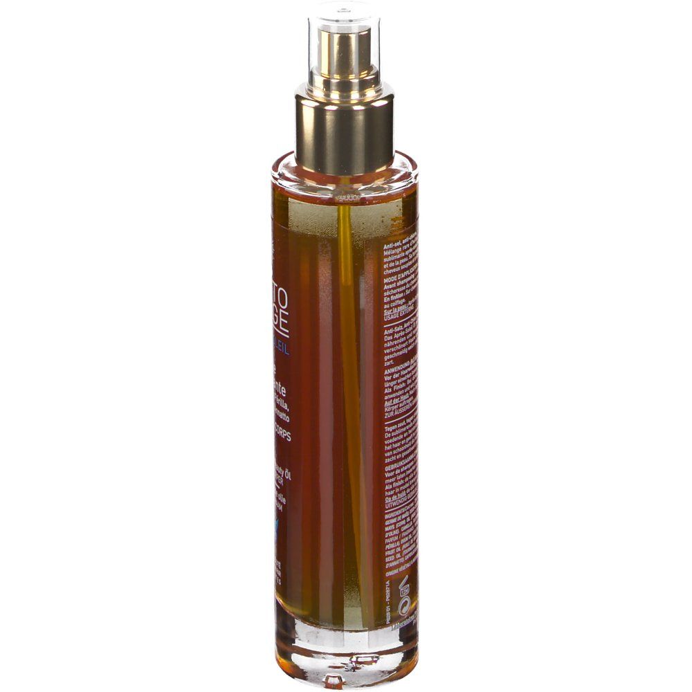 Braune Flüssigkeit in einer durchsichtigen Sprühflasche mit goldenem Sprühkopf.