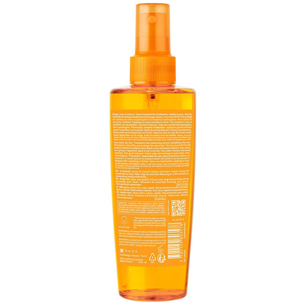 Dos du flacon BIODERMA Photoderm BRONZ. Informations textuelles sur fond orange. Code QR et logos.