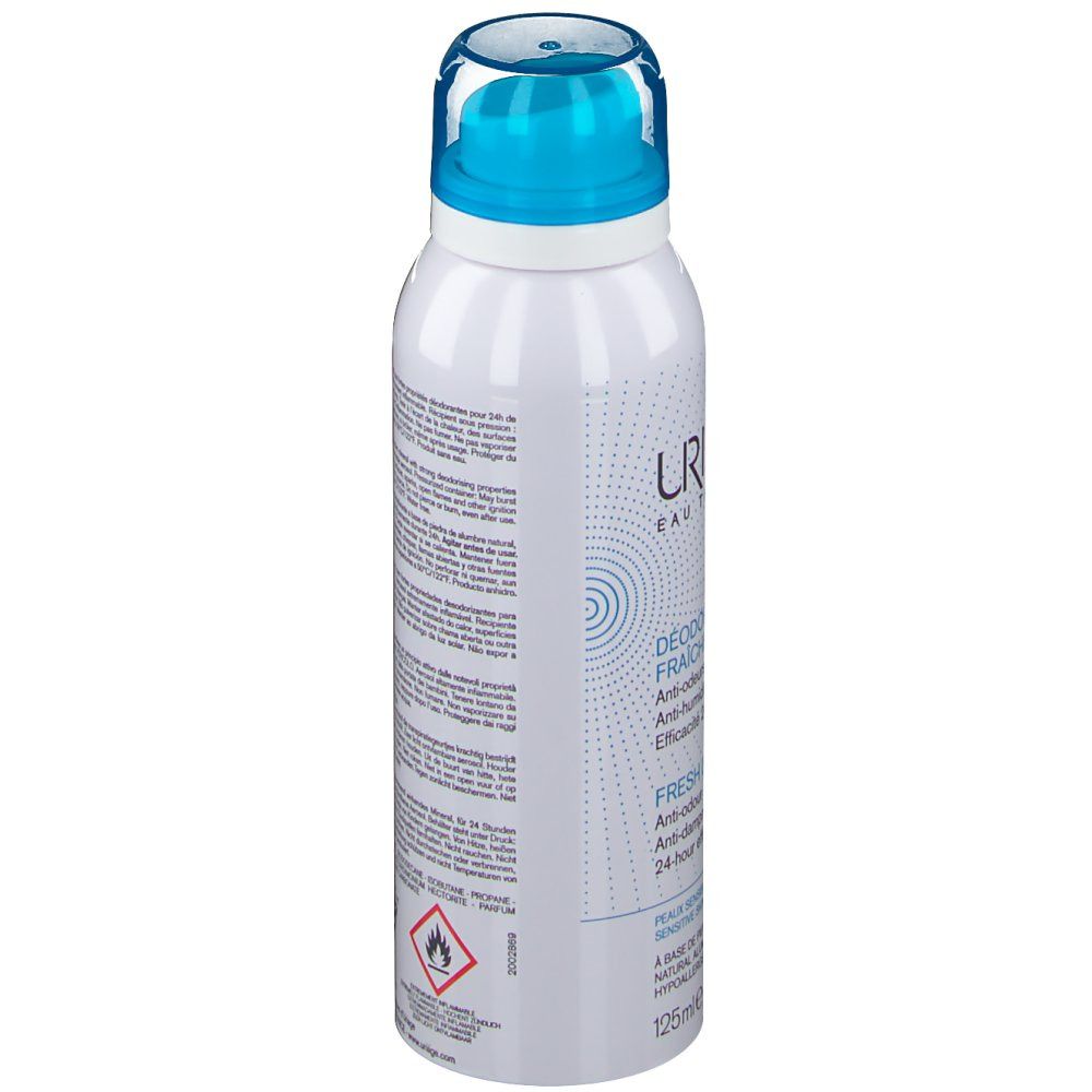 Flacon de spray déodorant blanc avec tête bleue. Texte, avertissements et symboles.