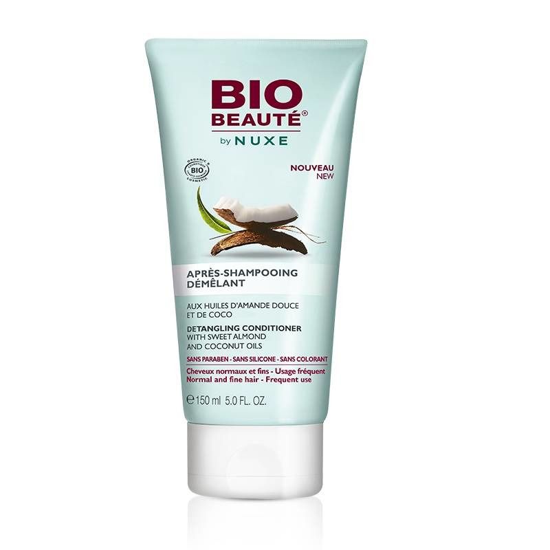 Tube de conditionneur capillaire BIO BEAUTÉ by NUXE. Inscription: Après-Shampooing Démêlant. Illustration de noix de coco.