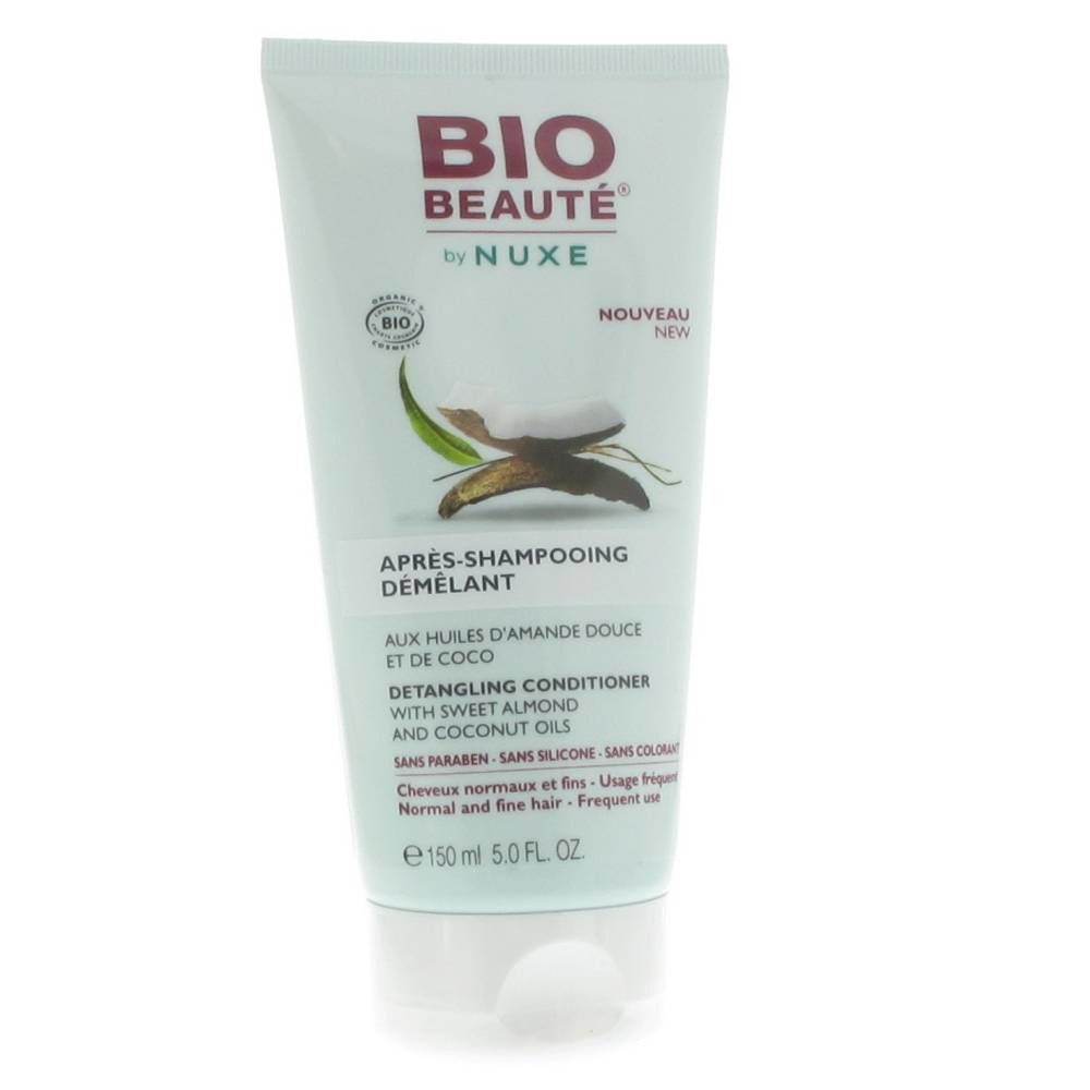 Tube de conditionneur capillaire BIO BEAUTÉ by NUXE. Inscription: Après-Shampooing Démêlant. Illustration de noix de coco.