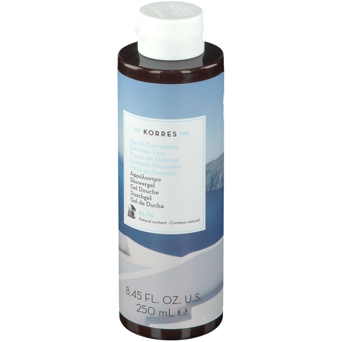 Gel douche KORRES Santorini. Flacon cylindrique avec bouchon blanc. Étiquette avec nom et informations.