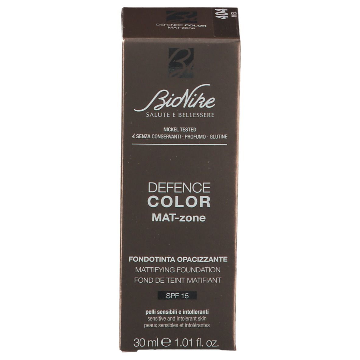 Emballage du fond de teint BioNike DEFENCE COLOR MAT-zone. Boîte marron avec informations sur le produit et logo.
