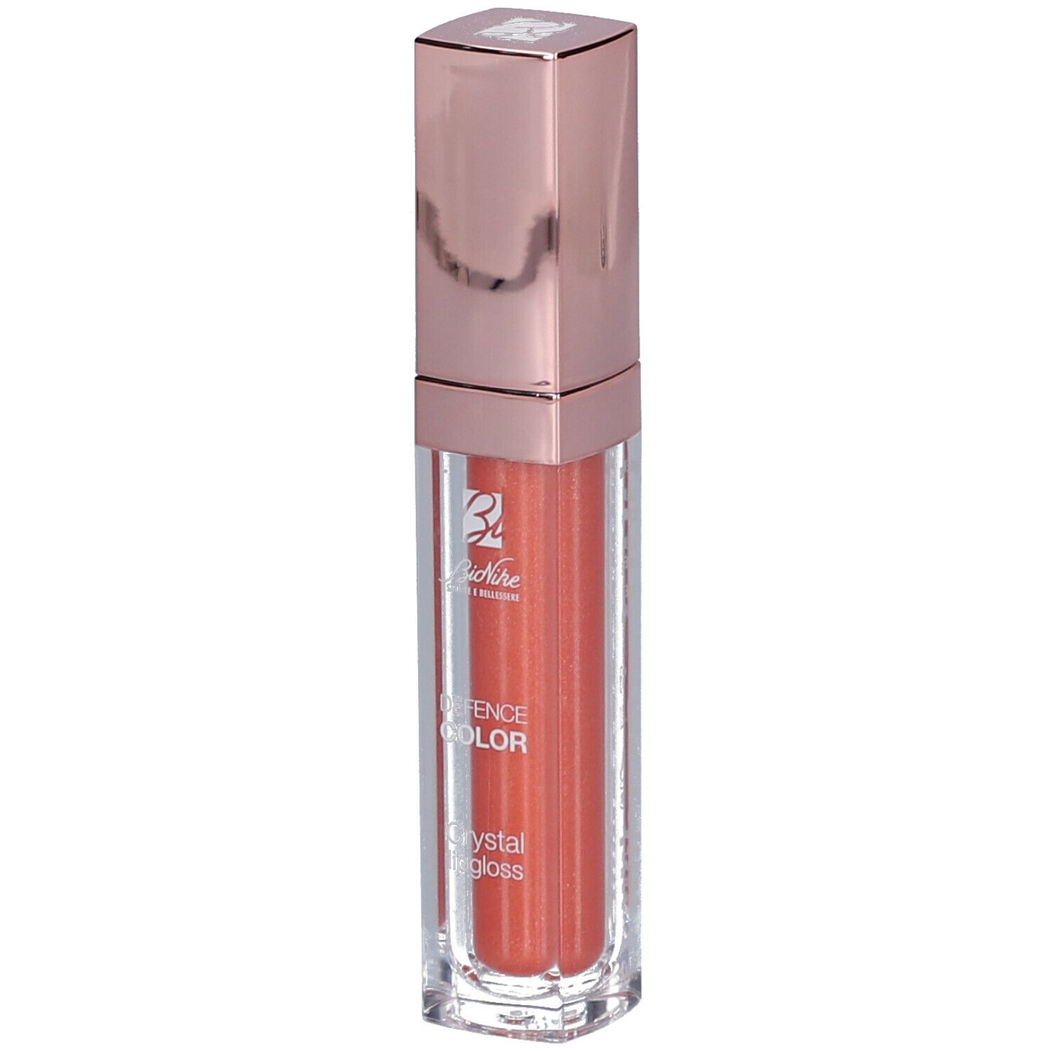 Korallenfarbener Lipgloss in einer transparenten Hülse mit roségoldfarbenem Deckel. Marke: BioNike DEFENCE COLOR.