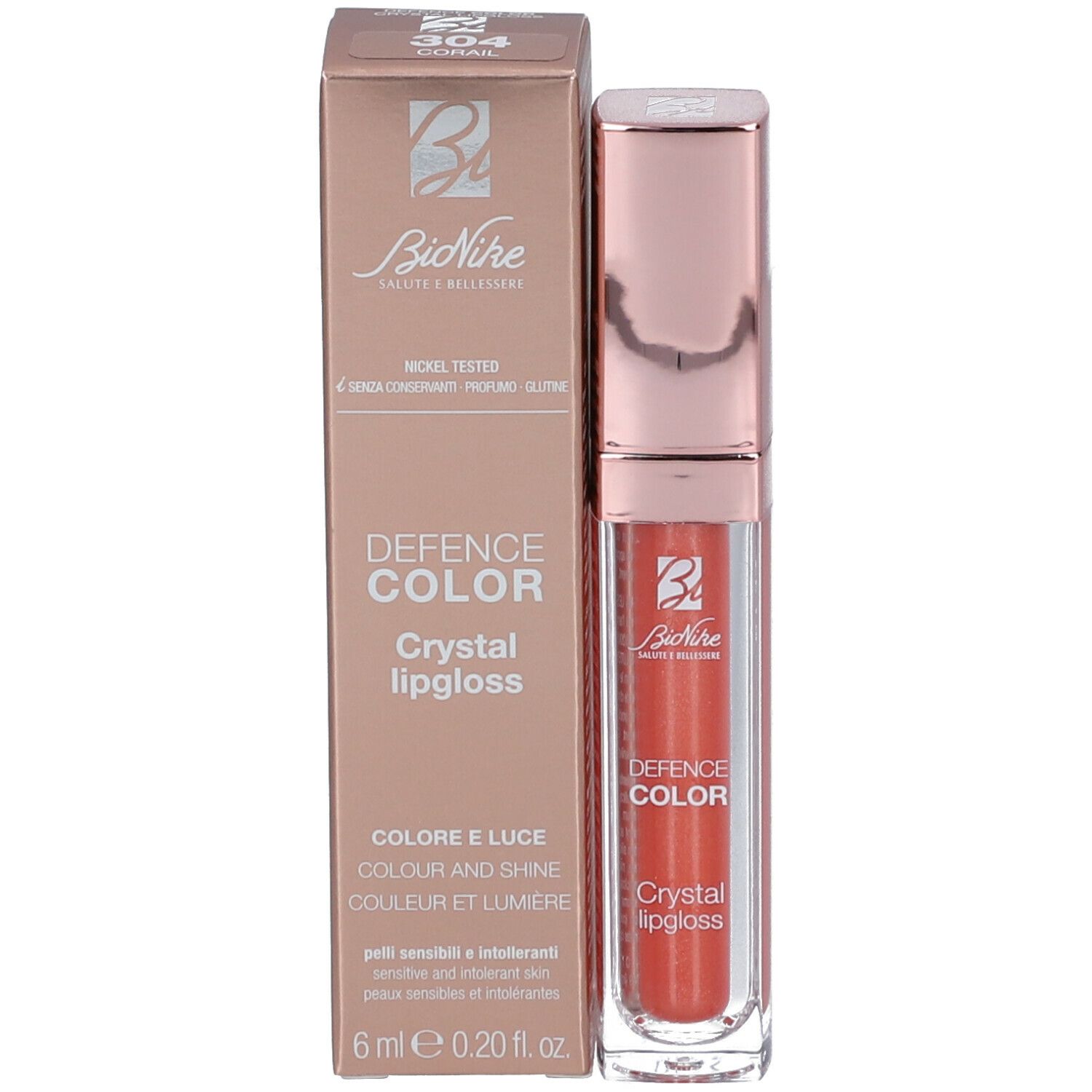Lipgloss mit Verpackung. Korallenfarbener Lipgloss in einer transparenten Hülse. Marke: BioNike DEFENCE COLOR.