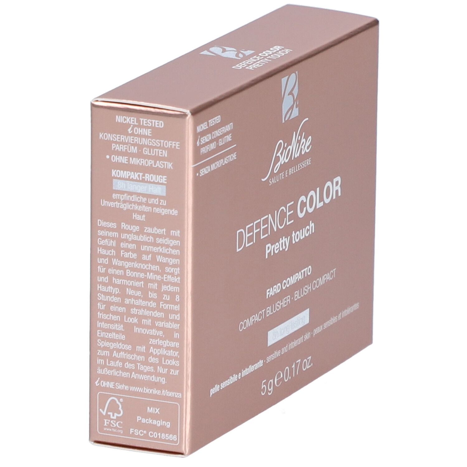 Kompakt-Rouge-Verpackung. Rosa-goldene Schachtel mit Produktnamen und Logo. Text: Nickel getestet, ohne Konservierungsstoffe, Parfum, Gluten.