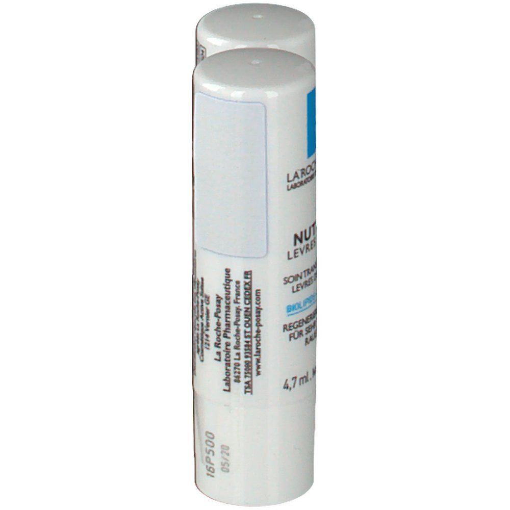 Stick à lèvres blanc avec texte bleu et noir. Inscription: Nutritic, 4,7 ml. Avec date de production et de péremption.