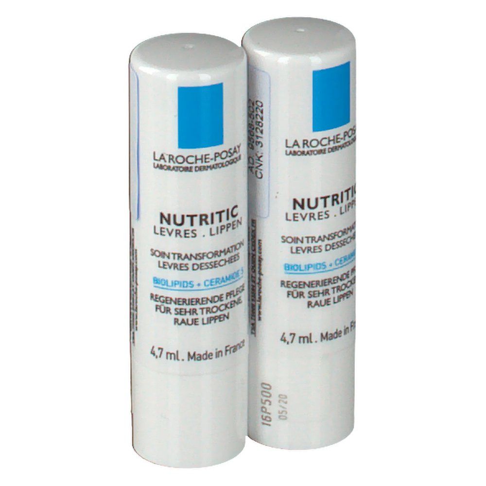 Deux sticks à lèvres blancs. Inscription: La Roche-Posay, Nutritic, 4,7 ml. Avec date de production et de péremption.