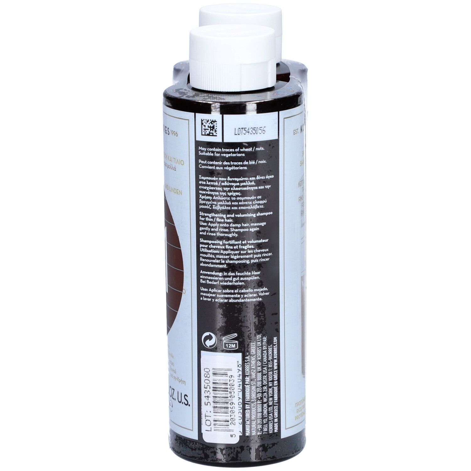 Dos d'une bouteille de shampooing. Bouteille noire avec étiquette blanche. Texte multilingue, ingrédients.